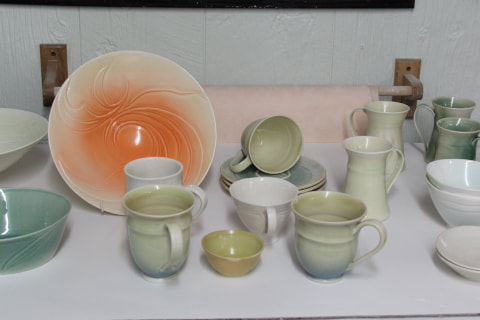 A display of the porcelain dinnerware pieces that were made during the recording of the online workshop 