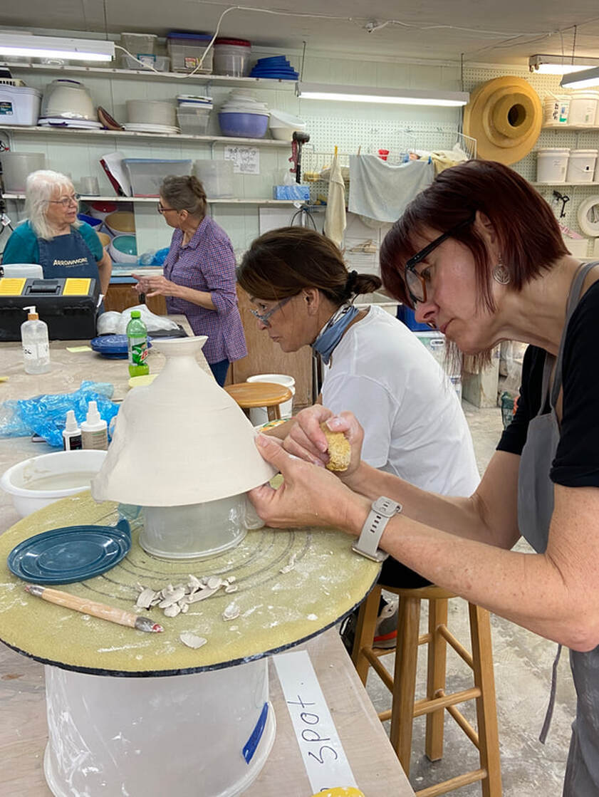 Antoinette  with potters who are attending a hands-on porcelain workshop her Mississippi studio. 