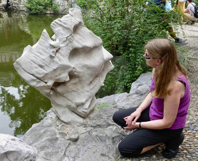 Gayle Fichtinger with scholars stone in Yu Garden, Old Shanghai, China.