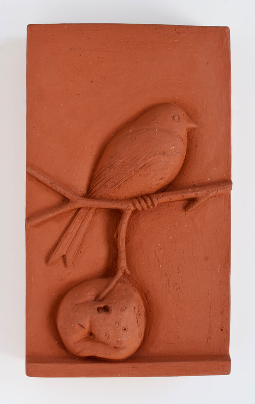 ceramic relief of songbird