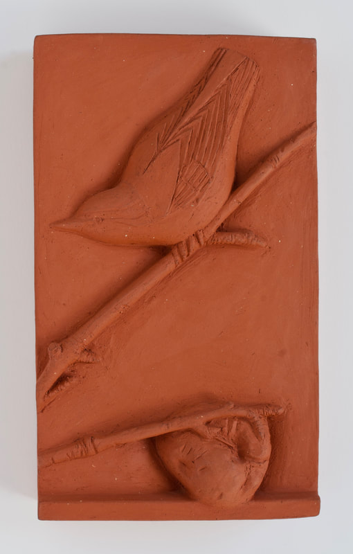 ceramic relief of songbird