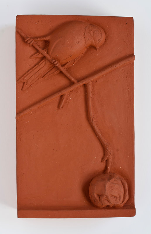 ceramic relief of songbird