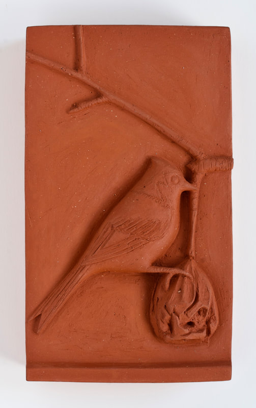 ceramic relief of songbird