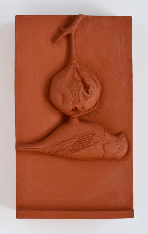 ceramic relief of songbird