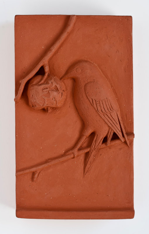 ceramic relief of songbird