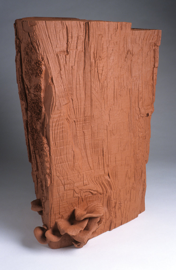 ceramic sculpture of firewood