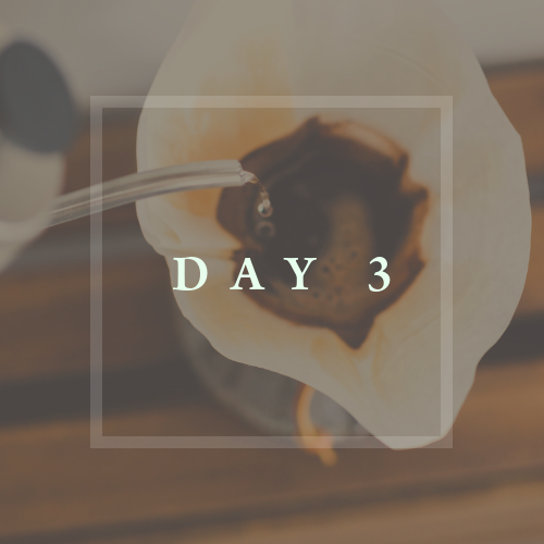 Here is coffee being brewed. In a beaker like glass and a coffee filter, hot water is being poured on coffee grinds. There is a slight white square overtop of the photo. In the square there is white capital text that says 