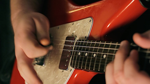 Chris Blackwell from The Rocktronix's red guitar