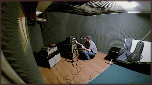 Recording Engineer Rush Anderson setting up microphones.
