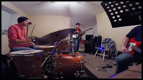 The Rocktronix composing and writing a song.