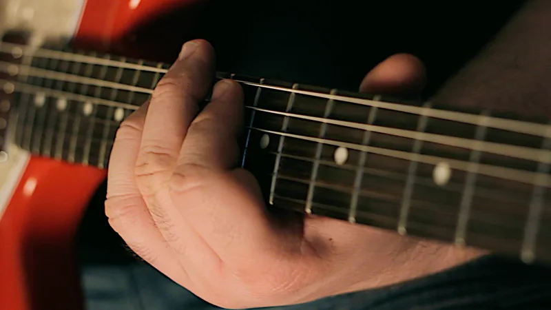 Close up of guitarist Chris Blackwell