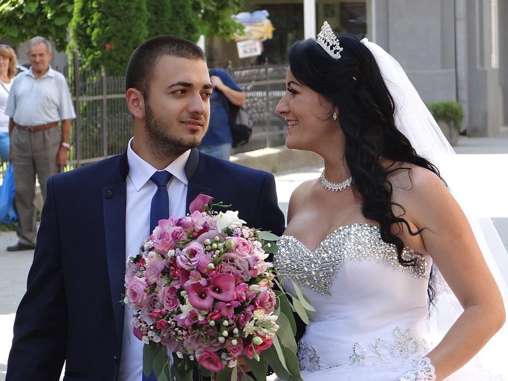 bride and groom, wedding day, pink bouquet, crystal wedding dress, veil, wedding tiara, wedding suit