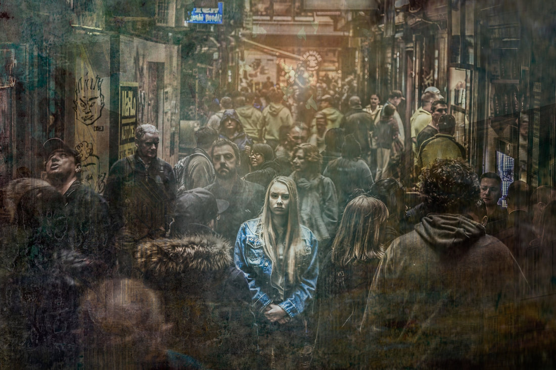 woman standing in crowd anxious