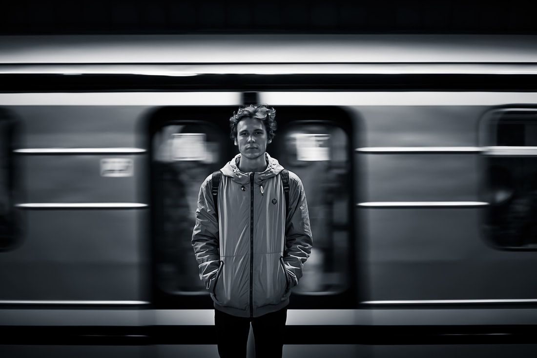 man standing in front of train