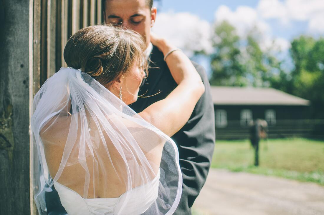 bride and groom hugging