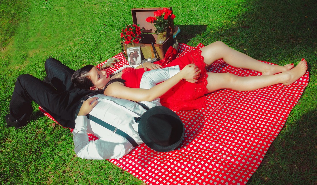 man and woman having a picnic