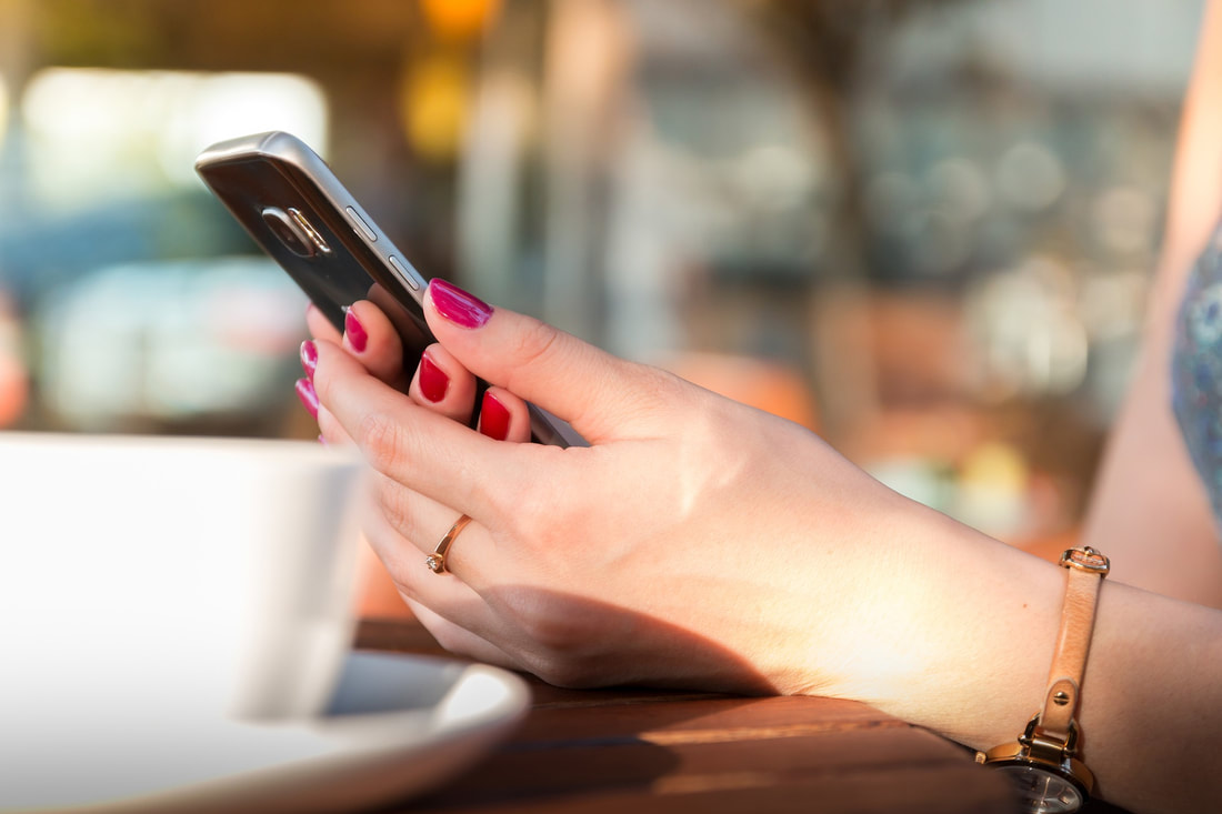 woman holding a cell phone