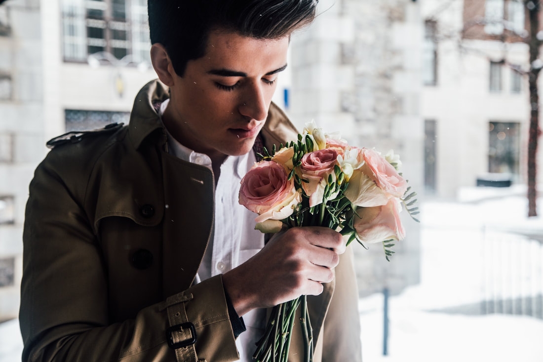 man holding flowers