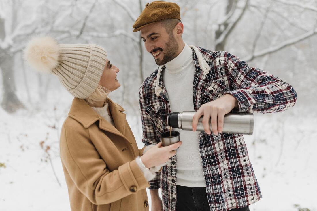 couple smiling in the snow