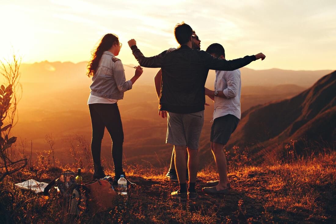  people dancing at sunset