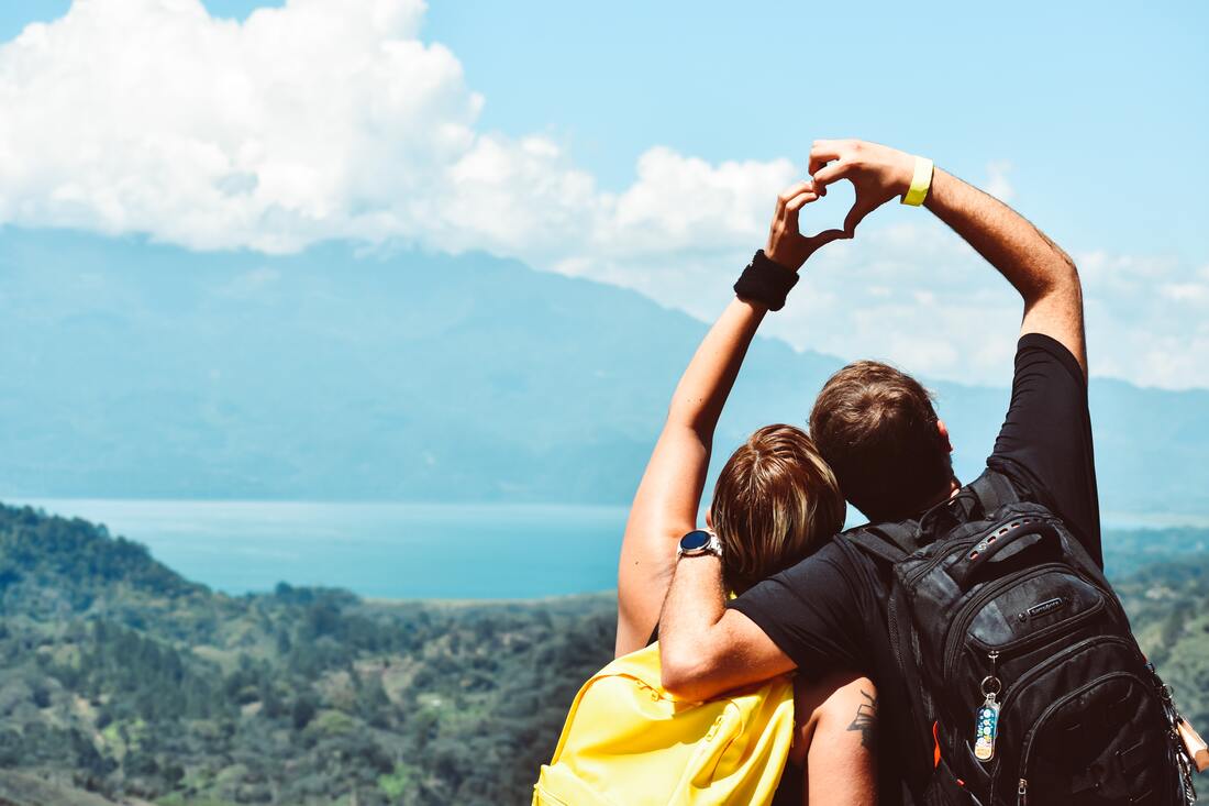 couple making heart shape with their hands
