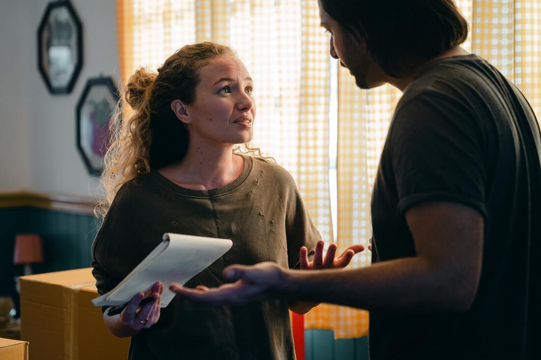 couple holding papers