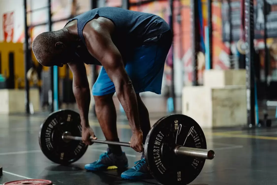 man lifting weights