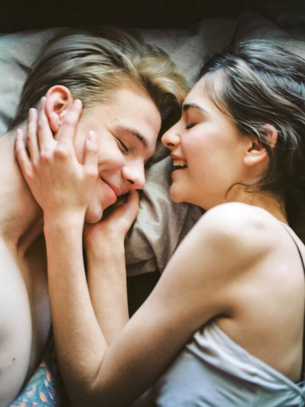 man and woman in bed