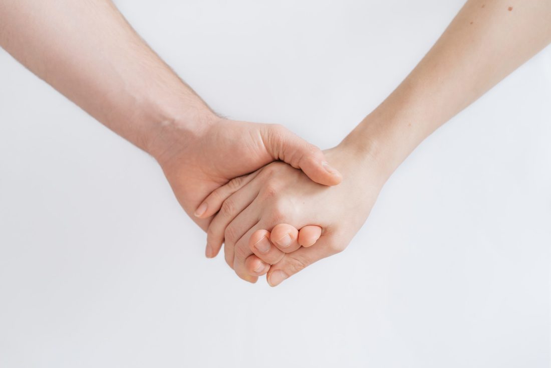 man and woman holding hands