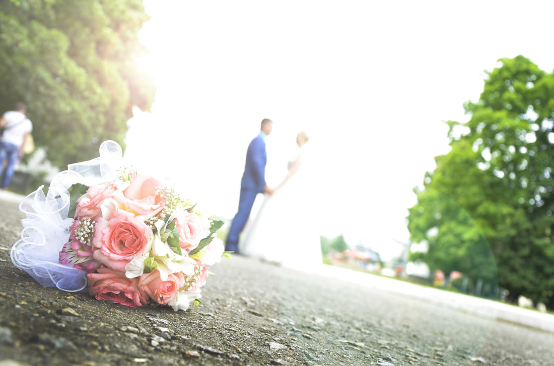 bride and groom wedding day pink flowers