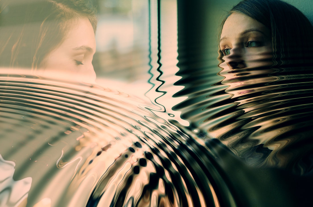 woman looking out window