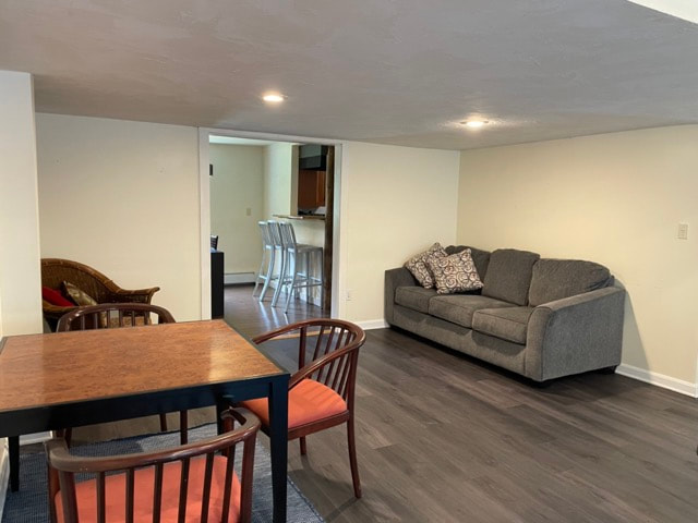 living room with couches, pool table, seating areas
