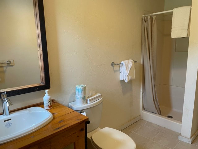 Bathroom with shower, toilet and sink