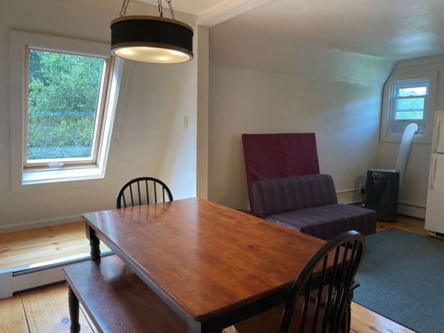kitchen with stove, microwave, sink and dining  table