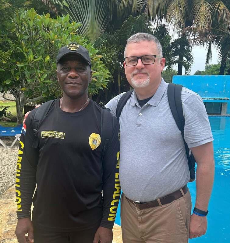 A local police chaplain and me in the Dominican Republic.