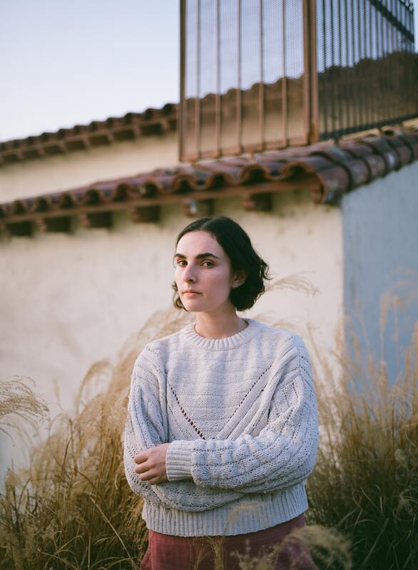 Women with dark hair standing with her arms crossed over her chest. This illustrates that highly sensitive people need to have good boundaries and self advocate. Sacred Circle Holistic Healing offers online therapy in Kansas for self-esteem, anxiety, trauma, and abusive relationships.