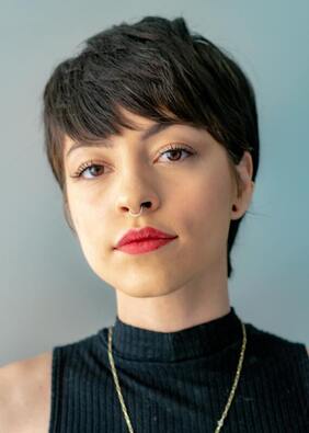 Young woman with dark brown hair and a septum piercing looking into the camera. This represents the clientele Maggie Jones Boyle serves, young adults with relationship issues.