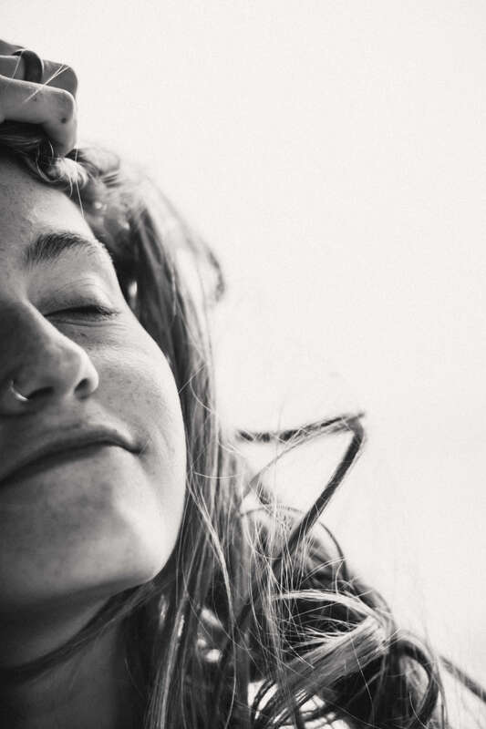 Black and white close up of a woman's face illustrating the young women who seek therapy and counseling with us in Kansas and Florida.