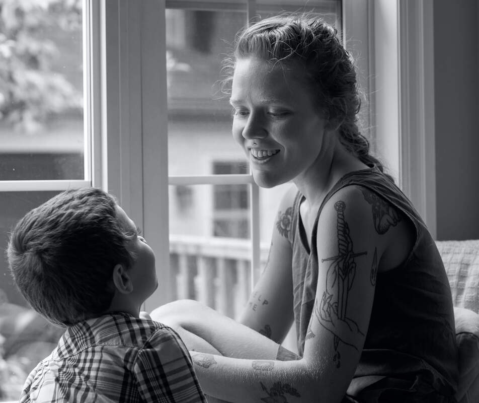 A mother and her son. This illustrates childhood trauma that effects us in adulthood. We offer online therapy in Kansas and Florida for treating childhood trauma.