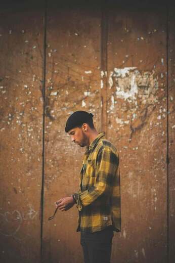 Side profile of young man looking down. This represents the clients that Maggie Jones Boyle sees in therapy to heal their childhood trauma.