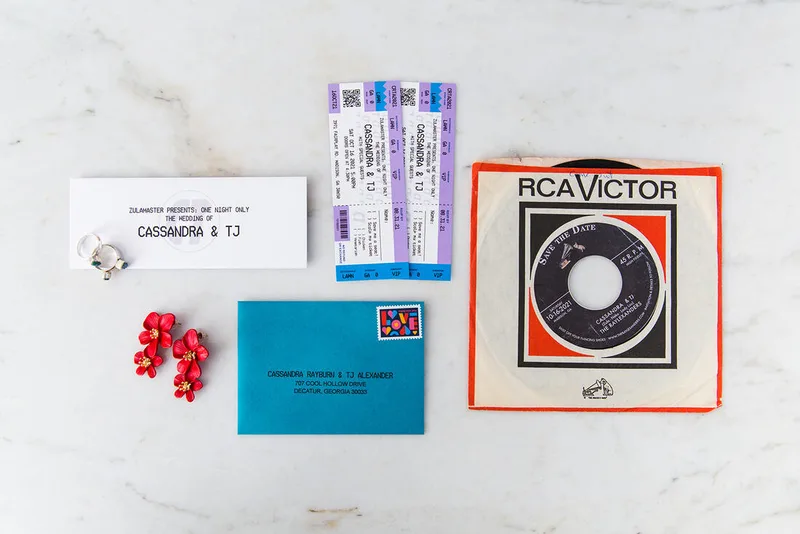 Two wedding invitations designed to look like concert tickets, ticket sleeve with weddnig names & date, Bright blue stamped and addressed envelope, vintage 45 record