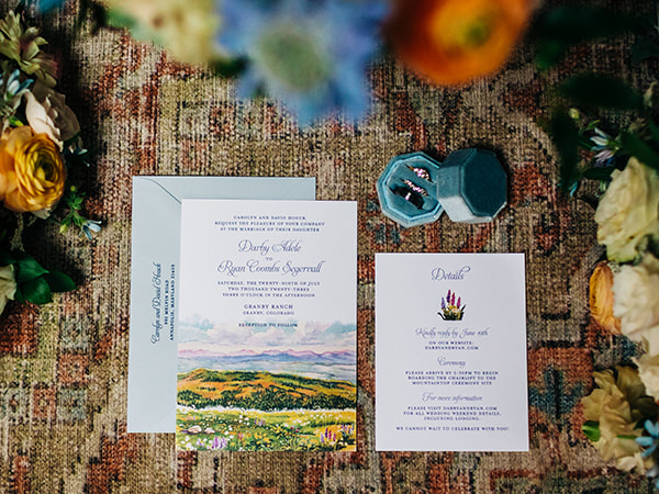 Invitation with watercolor mountain scene, Details card with watercolor flowers, Blue envelopes