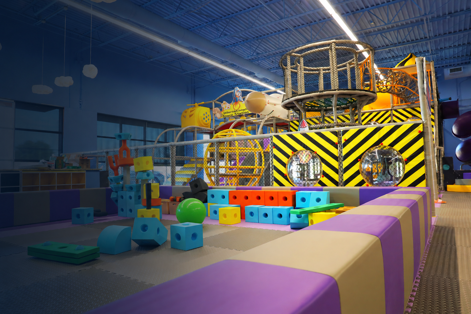 Colorful soft play blocks, climbing structures and slides inside Smarty Sprouts Kids’ Club.