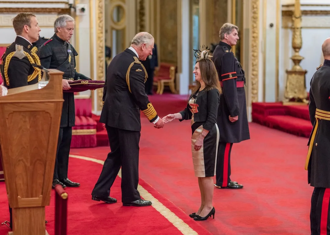 Jackie Jenks receiving OBE from King Charles III