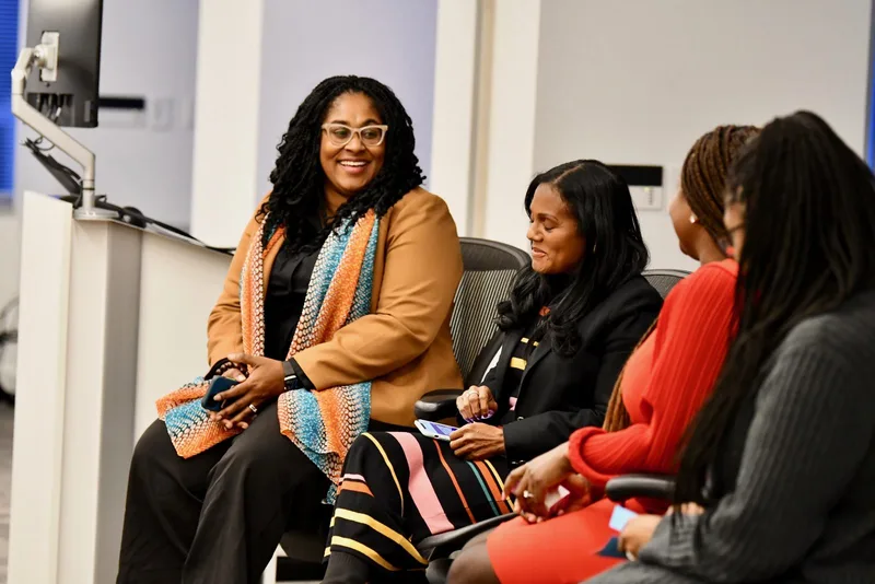 Dr. LaNysha Adams moderating a panel discussion