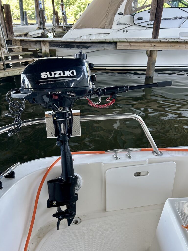 Suzuki outboard motor on small docked boat