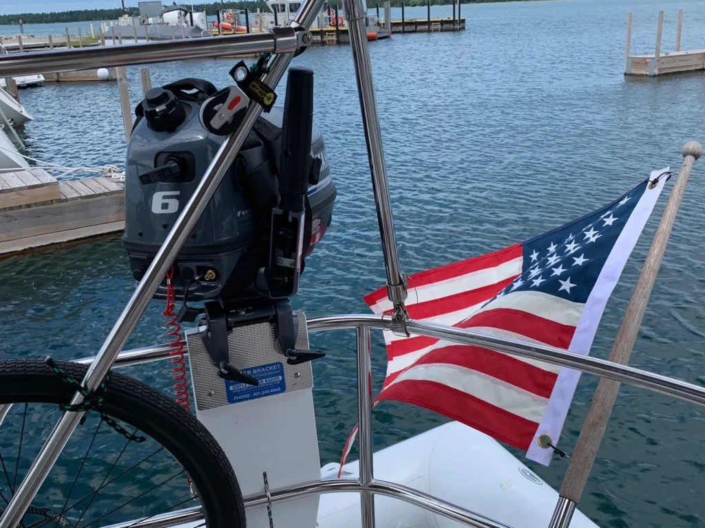 American flag flying from boat at marina