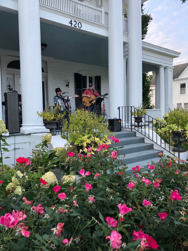 Tyler Fairburn mid-performance during Porch Fest in Troy Ohio