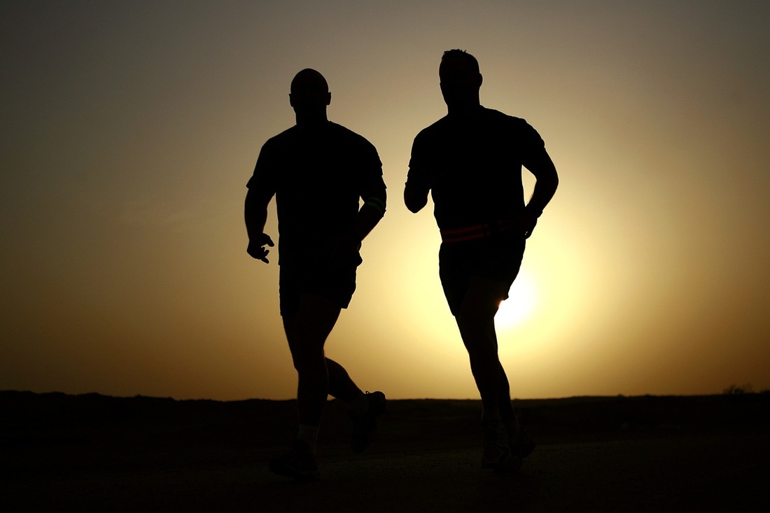 2 people running