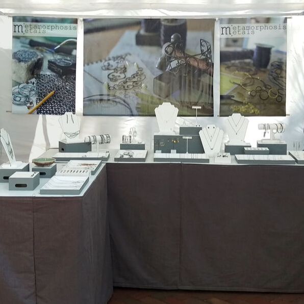 a display of jewelry at a craft show